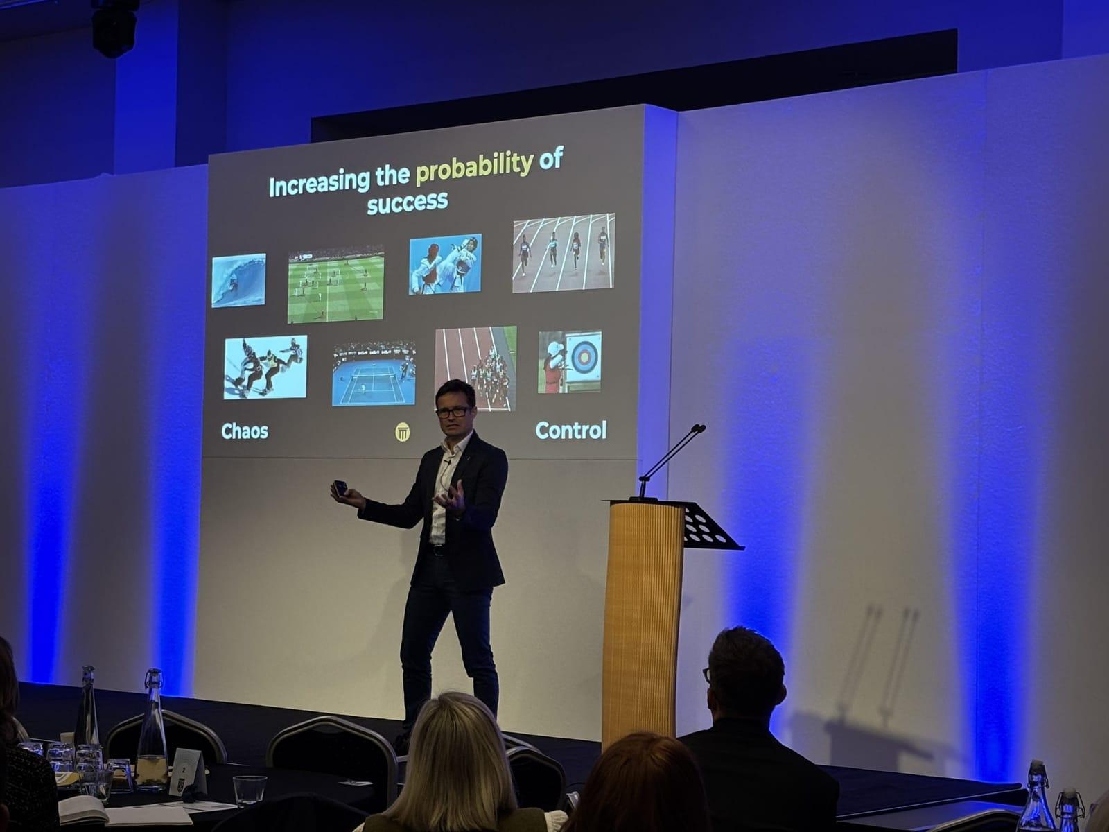Steve Ingham on stage — 'Increasing the probability of success' slide